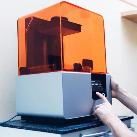 In-office 3D printer creating custom dental restorations at Sumner Dental Group.