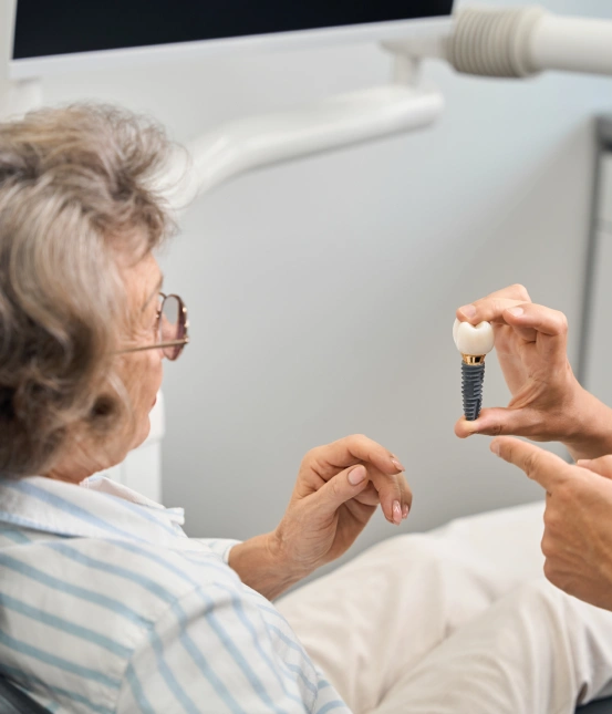 Dentist discussing the cost of dental implants with a patient.