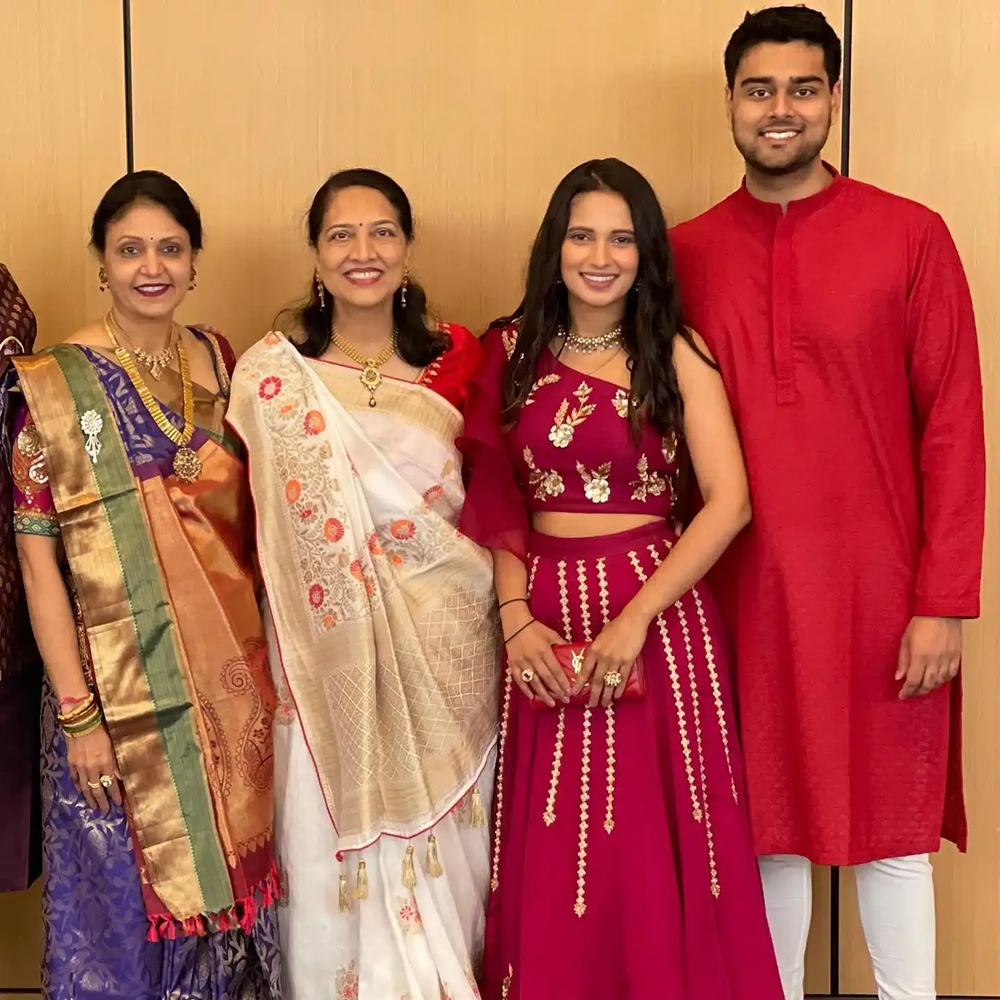 Dr. Dushyant Patel and family posing together in traditional attire.