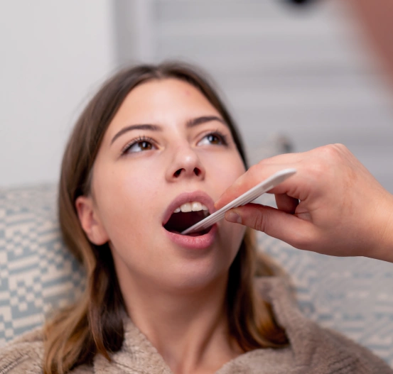 Patient receiving oral surgery treatment.