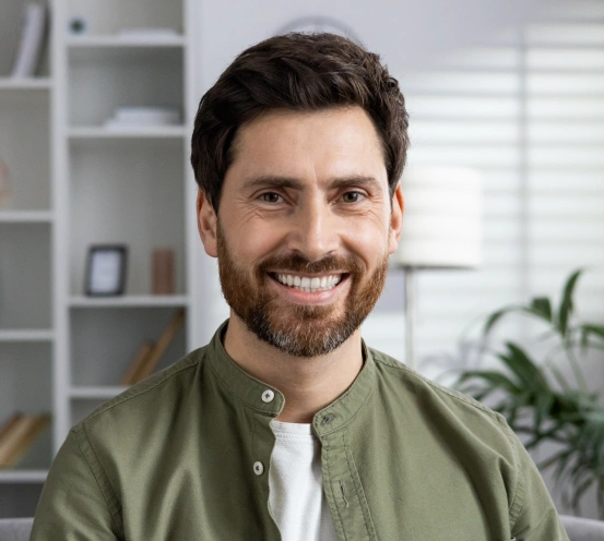 Smiling patient after restorative dental treatment.